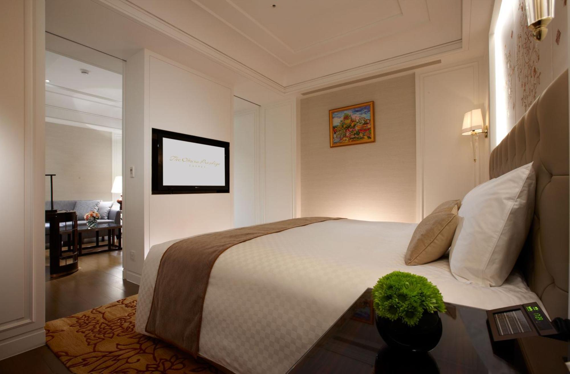Hotel The Okura Prestige Tchaj-pej Exteriér fotografie A bedroom at the hotel